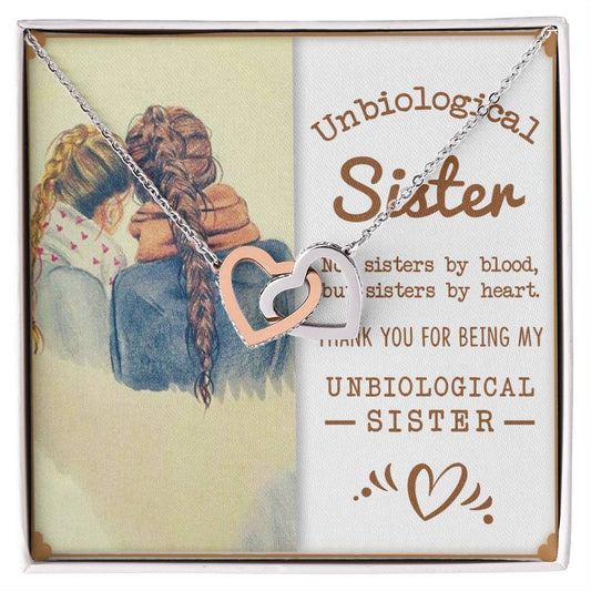 Two girls embracing, with a sentimental message about unbiological sisters, accompanied by a ShineOn Fulfillment To My Unbiological Sister, Sisters By Heart - Interlocking Hearts Necklace.