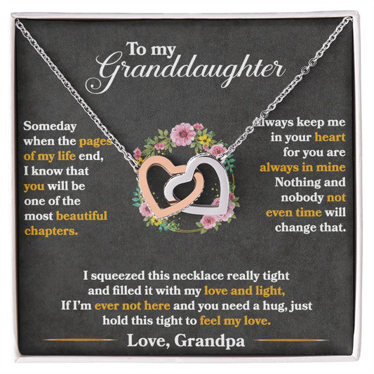 A sentimental anniversary gift display featuring a To My Granddaughter, Hold This Tight To Feel My Love - Interlocking Hearts Necklace adorned with cubic zirconia crystals and an affectionate message addressed to a granddaughter. (Brand: ShineOn Fulfillment)