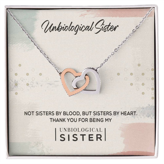 A To My Unbiological Sister, Thank You - Interlocking Hearts Necklace by ShineOn Fulfillment adorned with Cubic Zirconia Crystals, in a gift box with a message for a cherished friend considered a sister by heart.