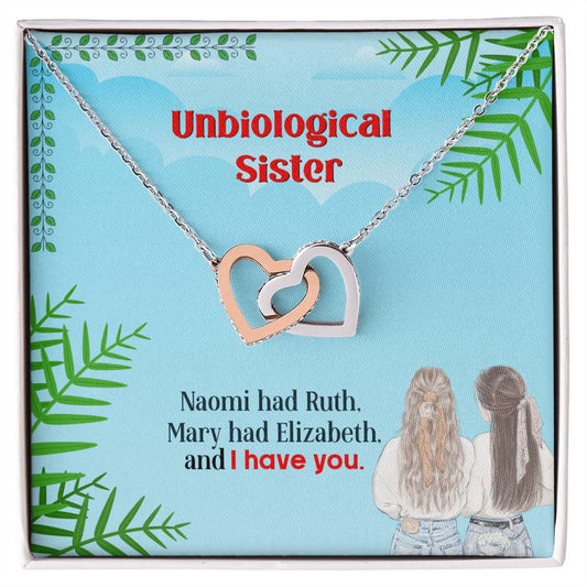 Two interlinked heart-shaped pendants with "unbiological sister" text, referencing close friendship, displayed on a themed card with a quote about sisterhood. This To My Unbiological Sister, I Have You - Interlocking Hearts Necklace serves by ShineOn Fulfillment.