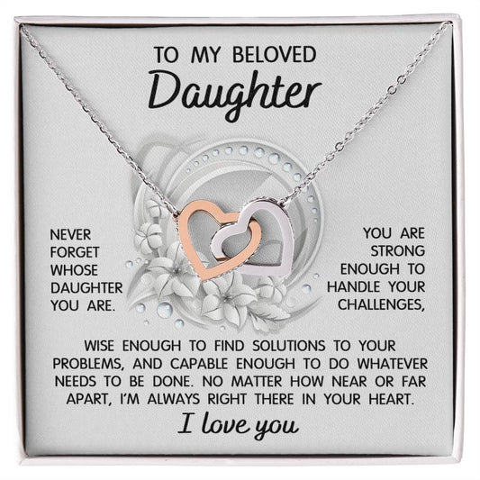 The "To Daughter, Always Right There - Interlocking Hearts Necklace" features a stunning interlocking hearts design with a rose gold finish and sparkling cubic zirconia crystals. It comes in a gift box that includes a heartfelt message for your beloved daughter, offering support, wisdom, and love.