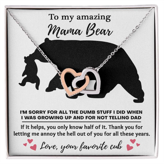 Sentence with replaced product: A necklace with a To Mom, Not Telling Dad - Interlocking Hearts Necklace pendant displayed on a card featuring a bear silhouette and a heartfelt apology message to "mama bear" from "your favorite cub.