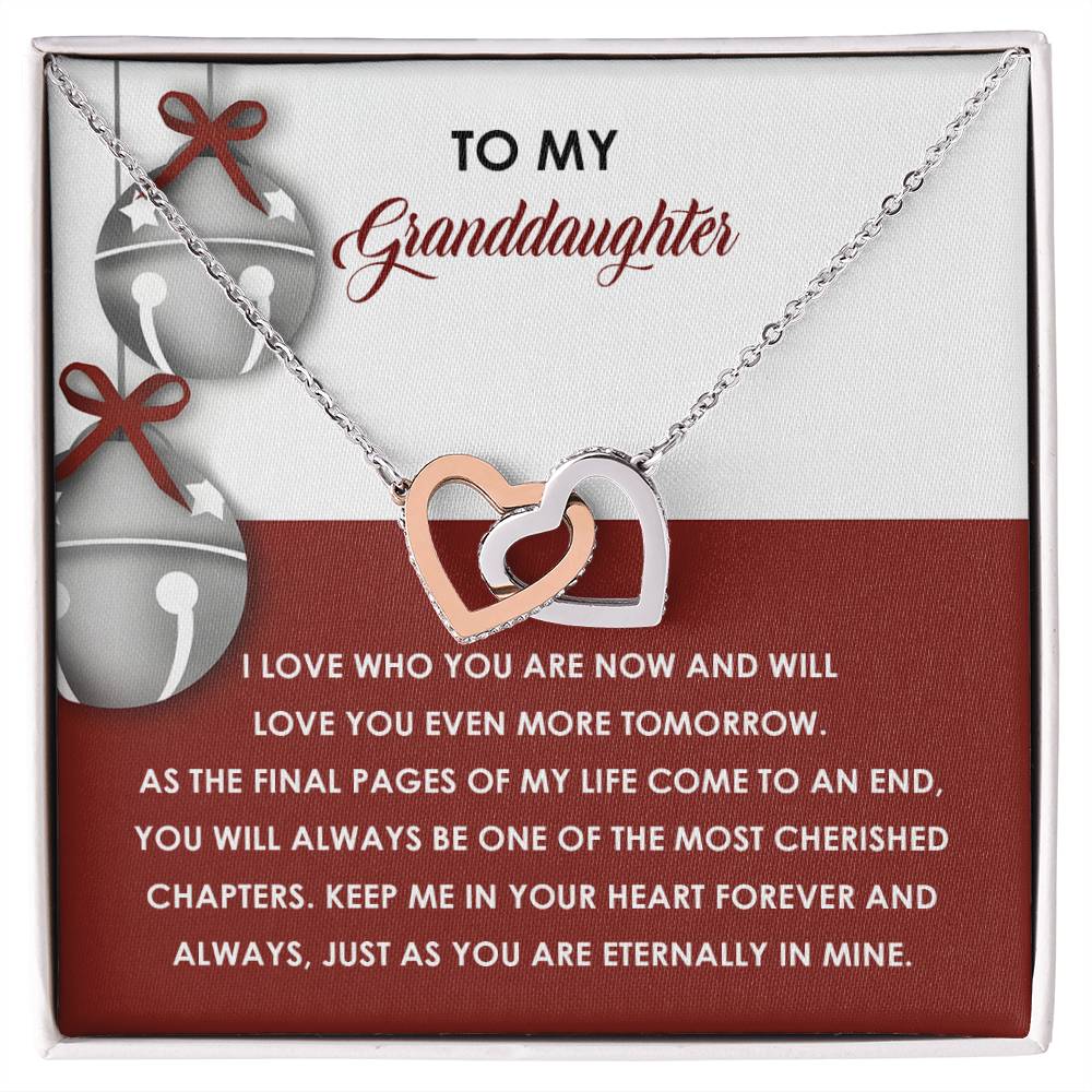 Interlocking Hearts Necklace named "Granddaughter-To An End," embellished with sparkling cubic zirconia crystals, comes accompanied by a card featuring a heartfelt message titled: "To My Granddaughter" about love and cherished memories.