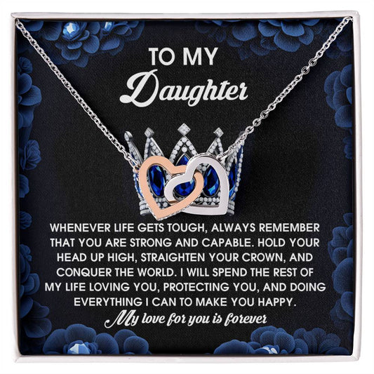 The "Daughter-Make You Happy" Interlocking Hearts Necklace features shimmering cubic zirconia crystals in a silver crown and heart with a rose gold finish, beautifully presented in a floral box with a heartfelt message to your daughter.
