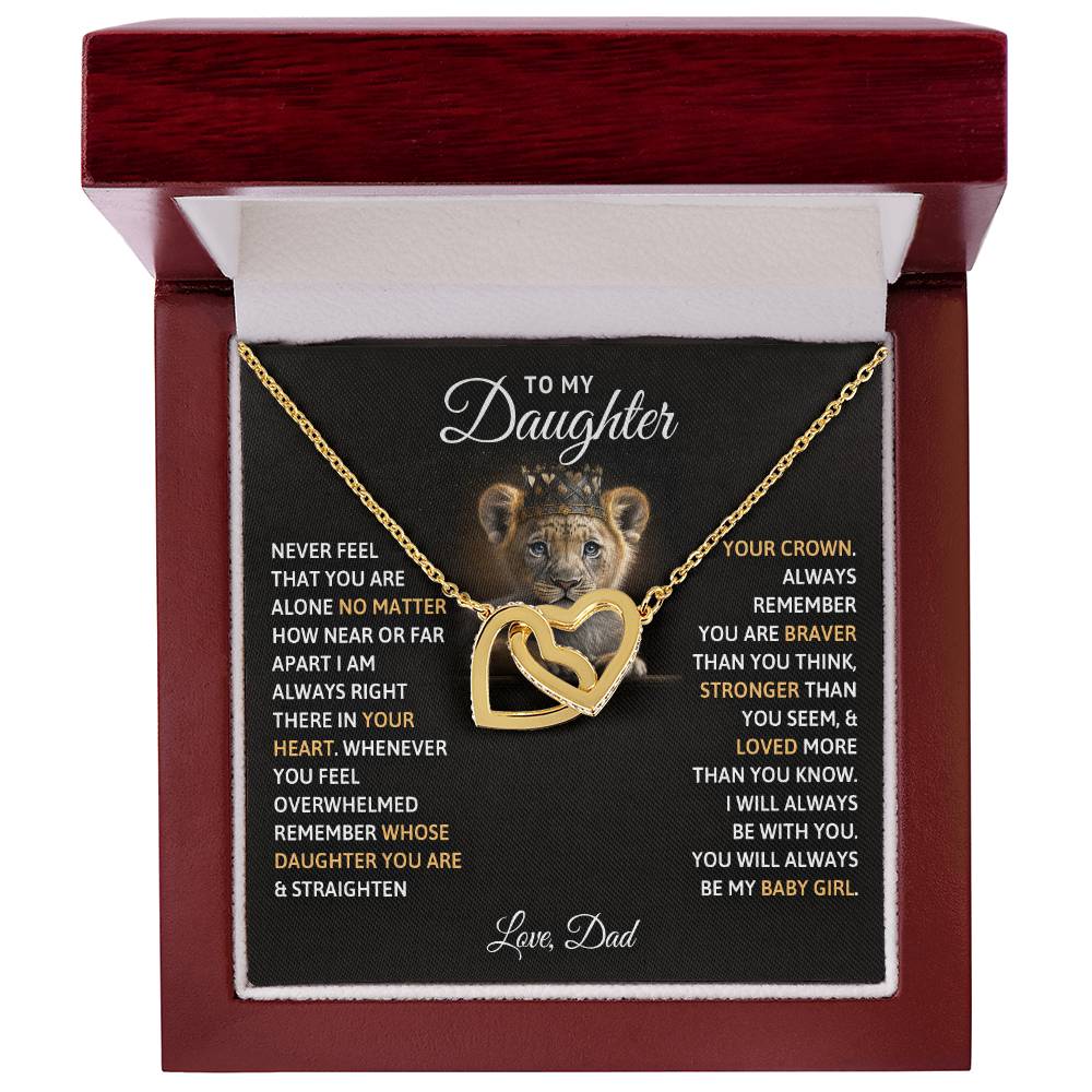 A heart-shaped pendant and chain in a gift box with an affectionate message from a father to his daughter features interlocking hearts and is adorned with Cubic Zirconia crystals, the To My Daughter, You Will Always Be My Baby Girls - Interlocking Hearts Necklace from ShineOn Fulfillment.