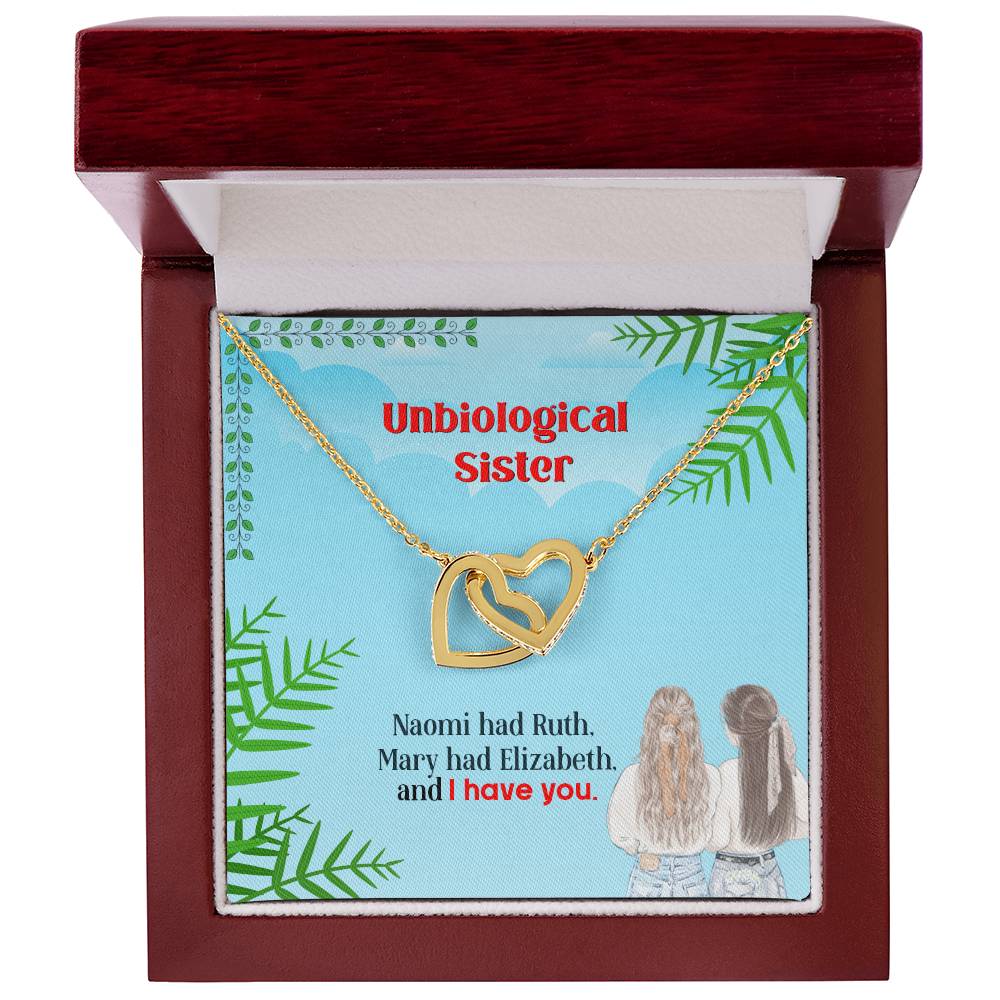 A To My Unbiological Sister, I Have You - Interlocking Hearts Necklace adorned with CZ crystals, presented in a box with a message as an anniversary gift by ShineOn Fulfillment.