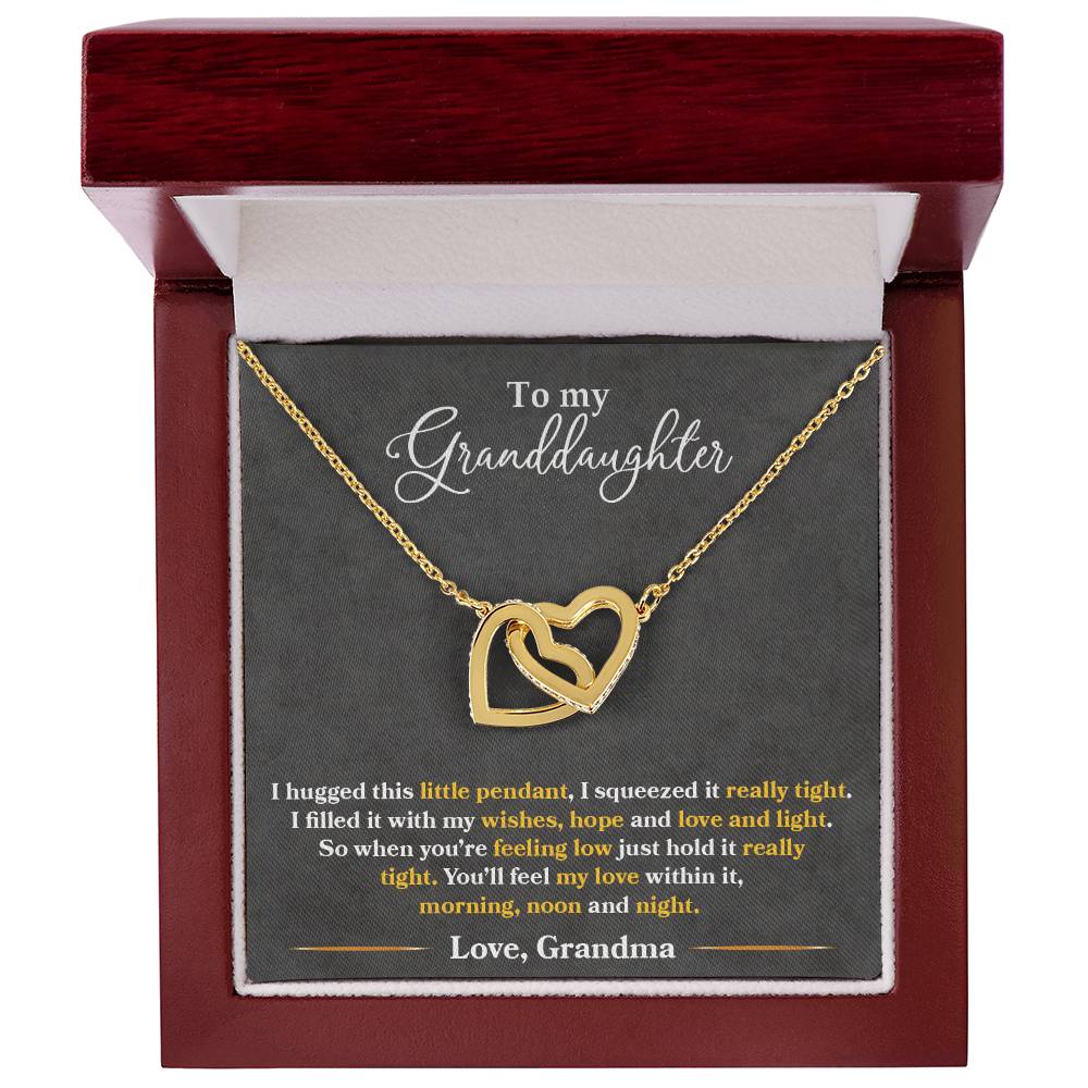 A To My Granddaughter, You_ll Feel My Love Within This - Interlocking Hearts Necklace with cubic zirconia crystals in a gift box, carrying a sentimental message to a granddaughter from a grandmother by ShineOn Fulfillment.