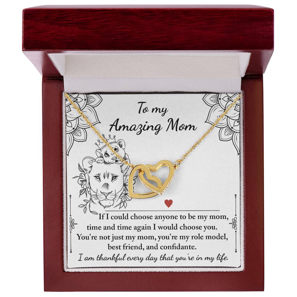 The "To Mom, Be My Mom - Interlocking Hearts Necklace" comes in a box with a note celebrating an amazing mom and is adorned with sparkling cubic zirconia crystals, making it a truly unique gift.