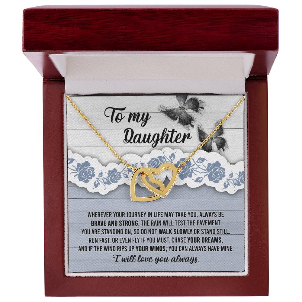 The "To Daughter, Always Have Mine - Interlocking Hearts Necklace," adorned with cubic zirconia crystals, is beautifully presented against a decorative card that inspires bravery, strength, and the pursuit of dreams. The message is addressed "To my Daughter" and concludes with "I will love you always.