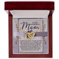 The Mom-Rare One - Interlocking Hearts Necklace, adorned with cubic zirconia crystals, comes in a wooden box. Inside is a heartfelt note expressing gratitude and love for a mother. A floral background enhances its elegance.