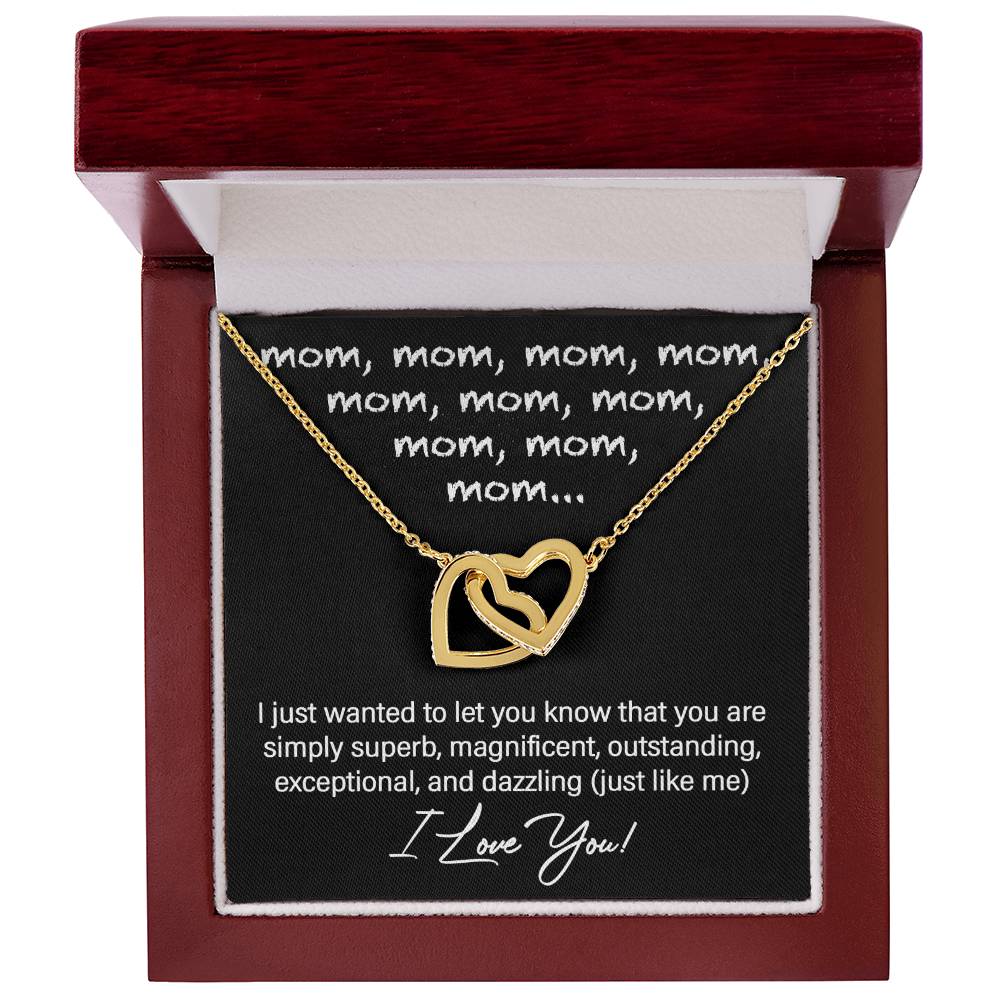 The "To Mom, Just Like Me - Interlocking Hearts Necklace" features cubic zirconia crystals and comes in a wooden box with a heartfelt message for mom inside, making it the perfect personalized gift to express your love and appreciation.