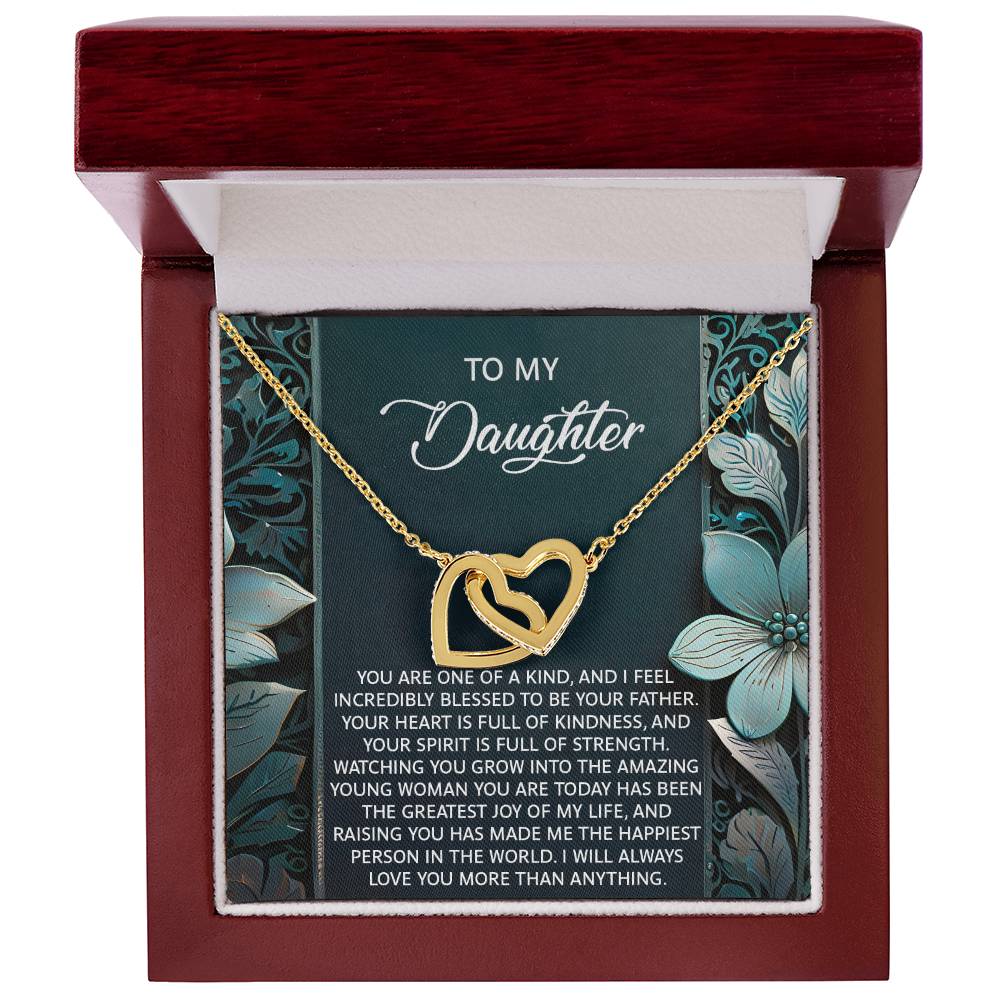 The Daughter-Happiest Person Interlocking Hearts Necklace features cubic zirconia crystals in a gold heart pendant, packaged in a jewelry box with a heartfelt message card for your daughter. It's the perfect gift she'll cherish forever.