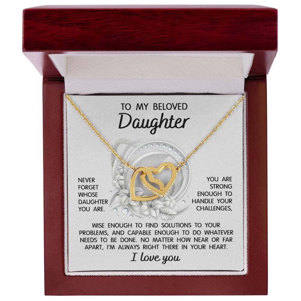 The "To Daughter, Always Right There - Interlocking Hearts Necklace" features a stunning interlocking hearts design with a rose gold finish and sparkling cubic zirconia crystals. It comes in a gift box that includes a heartfelt message for your beloved daughter, offering support, wisdom, and love.