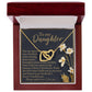 Inside the jewelry box, the Daughter-One Kind Interlocking Hearts Necklace with a rose gold finish is revealed. An accompanying card addressed "To my Daughter" includes a heartfelt message of love and appreciation, decorated with floral illustrations on the side.