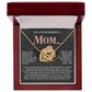 The Mom-More To Me 2 - Interlocking Hearts Necklace, adorned with cubic zirconia crystals, rests in a red jewelry box. Its lid conveys gratitude and love for Mom's unwavering support and guidance through the years.