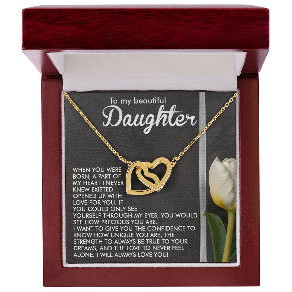 The Daughter-Heart Love - Interlocking Hearts Necklace, crafted with a rose gold finish and adorned with cubic zirconia crystals, is beautifully presented in a red jewelry box. The lid features "To my beautiful Daughter," a heartfelt message, and an image of a white tulip.
