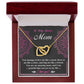 The Bonus Mom-An Amazing Mom Interlocking Hearts Necklace, adorned with cubic zirconia crystals, is showcased in an open red and white jewelry box against a floral-patterned background. A heartfelt message expresses gratitude and love to a "Bonus Mom.