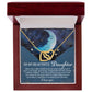 The Daughter-Grown Heart Interlocking Hearts Necklace is a gold heart-shaped pendant with a rose gold finish, packaged in a gift box. It features a night sky background with a crescent moon and stars, along with a heartfelt message for daughters about love, happiness, and dreams.