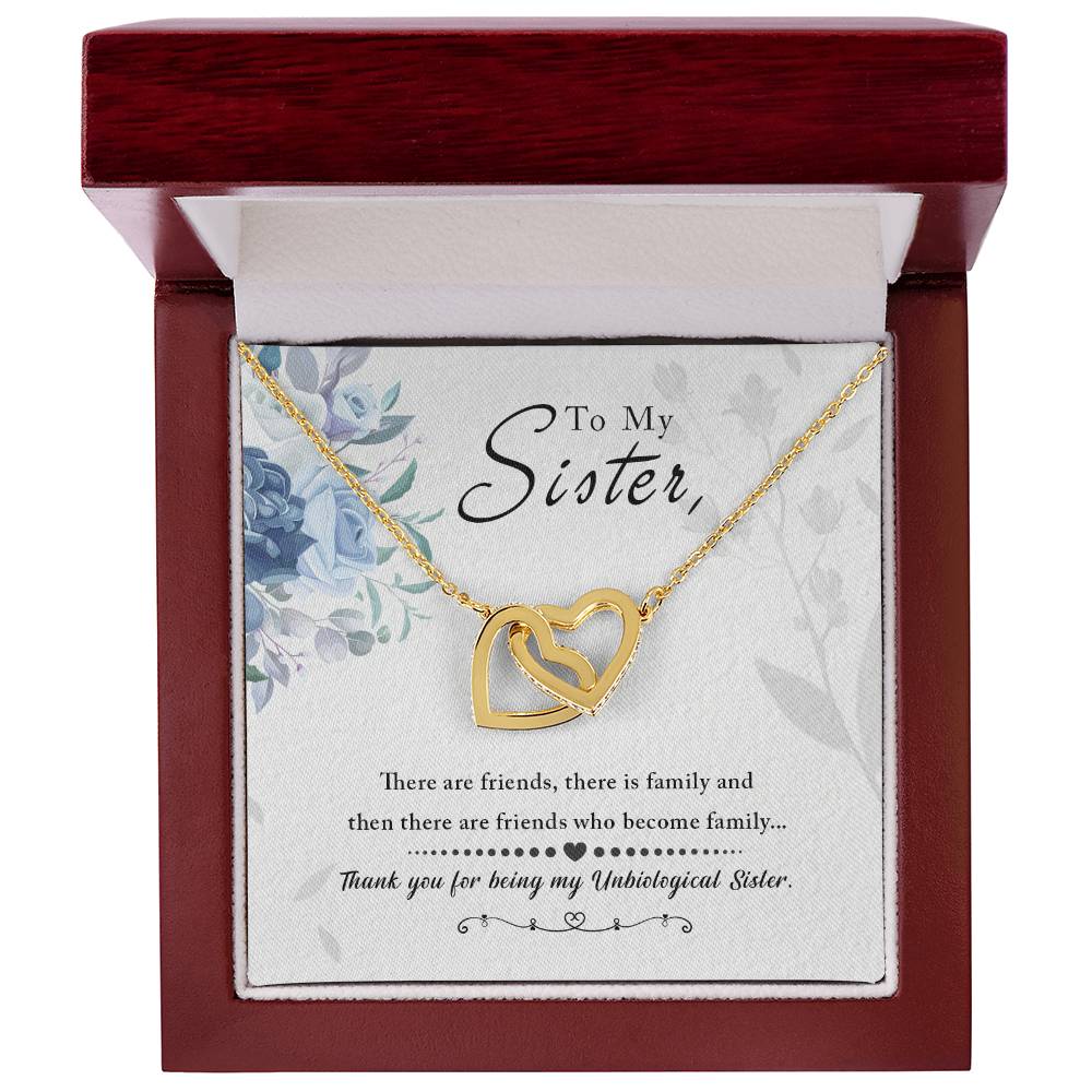 A "To My Sister, Thank You For Everything" Interlocking Hearts necklace by ShineOn Fulfillment in a gift box with a message for a sister signifying a strong bond.