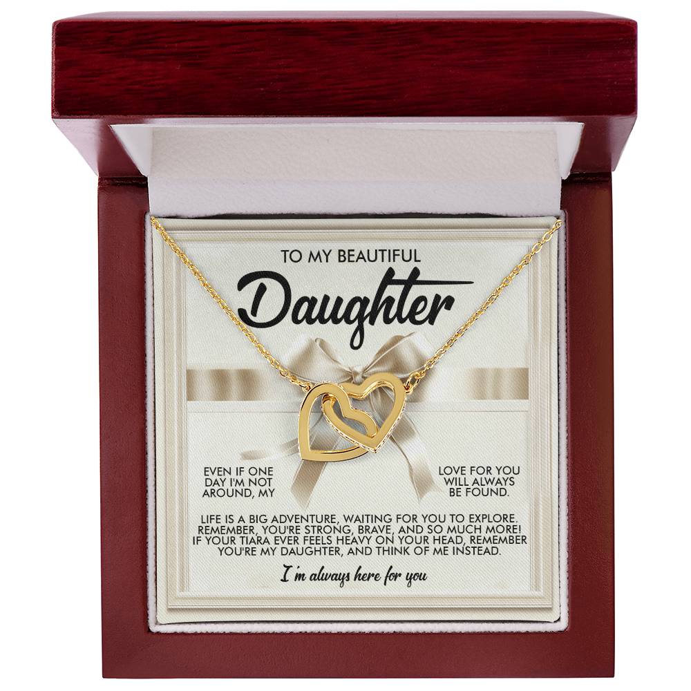 The Daughter-Heavy Tiara - Interlocking Hearts Necklace features a rose gold finish with sparkling cubic zirconia crystals, elegantly presented in an open wooden gift box. The lid carries a heartfelt message for a daughter, expressing love and support.