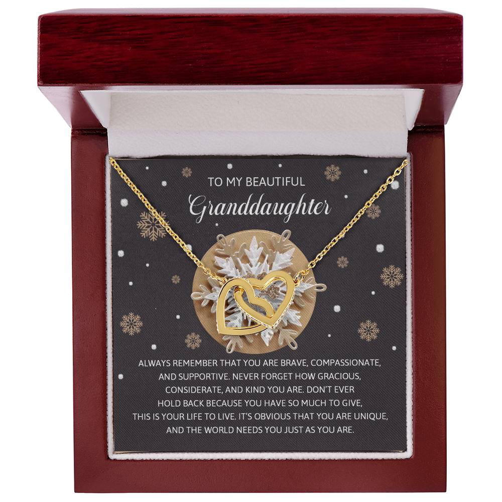 The Granddaughter-As You Are - Interlocking Hearts Necklace features a stunning rose gold finish, adorned with cubic zirconia crystals and an intricate snowflake design, elegantly presented in a gift box. It comes complete with a heartfelt message for your cherished granddaughter.