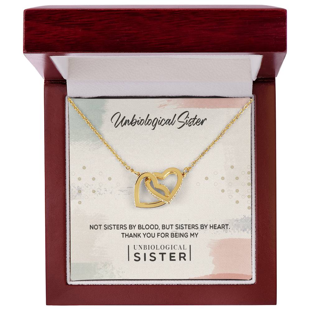 A "To My Unbiological Sister, Thank You" Interlocking Hearts necklace from ShineOn Fulfillment presented in a red box with a message for an "unbiological sister".