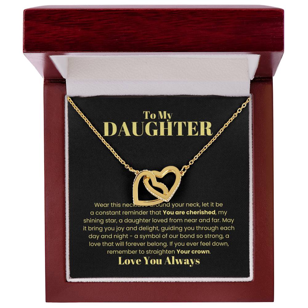 A gold Interlocking Hearts Necklace with cubic zirconia, nestled in a wooden box inscribed with an everlasting love message for a daughter. [Almost Sold Out] To My Daughter, Wear This Necklace - Interlocking Hearts Necklace.