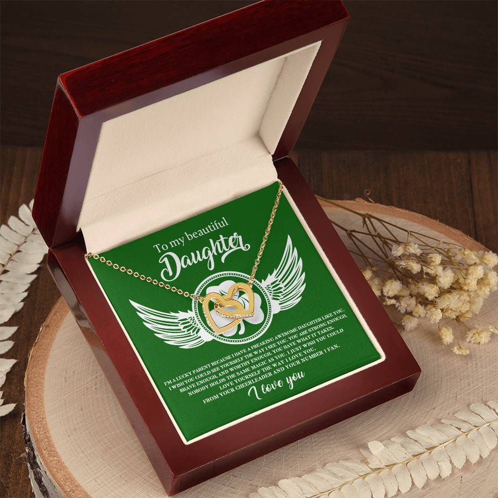 A green box with a To My Daughter, Lucky Parent - Interlocking Hearts necklace and wings on it from ShineOn Fulfillment.