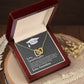 A "To My Granddaughter, Never Outgrow My Hearts - Interlocking Hearts Necklace" featuring a "2021" inscription, presented in a gift box with a message from ShineOn Fulfillment to a grandchild.