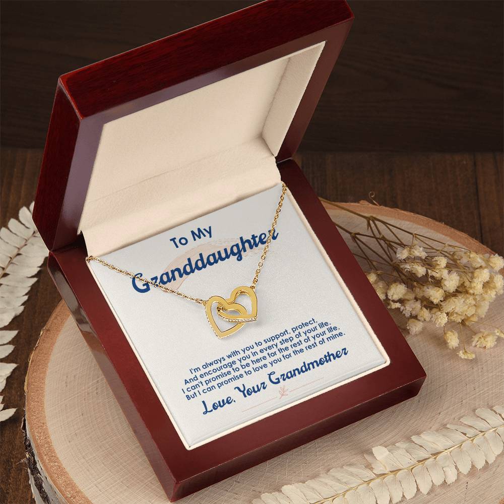 Heart-shaped pendant necklace with interlocking hearts and an inscription for a granddaughter, presented in a wooden gift box from ShineOn Fulfillment's "To My Granddaughter, I Love You For The Rest Of My Life - Interlocking Hearts Necklace".