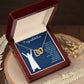 A wooden box containing a Prayer For Graduation - Interlocking Hearts Necklace with a dog charm and a note of congratulations from ShineOn Fulfillment.