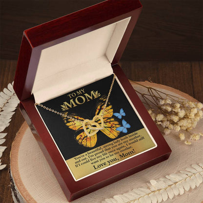 The Interlocking Hearts Necklace, almost sold out, embodies infinity with cubic zirconia crystals in a heart shape. Elegantly boxed, it includes a butterfly-illustrated card reading "To My Mom" with a loving message—a perfect unique gift for any occasion.