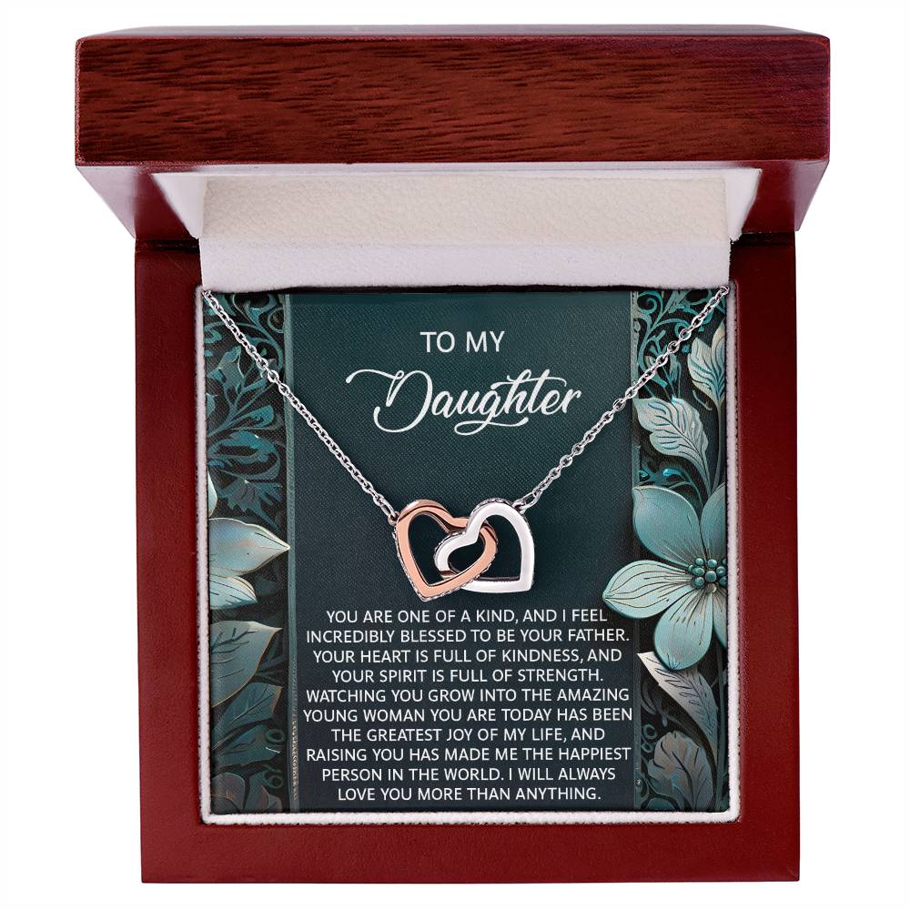 The Daughter-Happiest Person Interlocking Hearts Necklace features an 18k yellow gold finish with cubic zirconia crystals, presented in a jewelry box with a message reading "To My Daughter" and an affectionate note of love and pride from a parent.