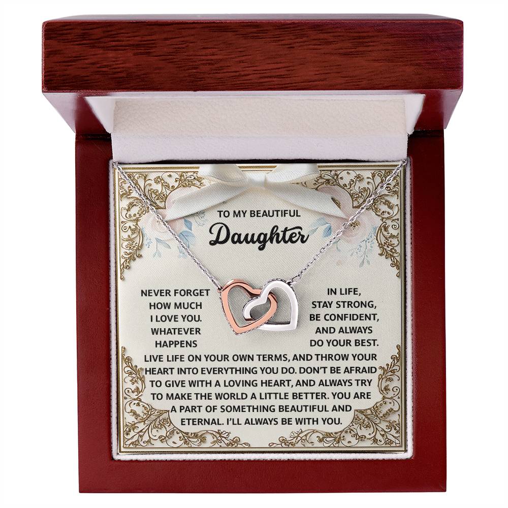 A jewelry box contains the "Daughter-Beautiful And Eternal - Interlocking Hearts Necklace," adorned with sparkling cubic zirconia crystals and a heartfelt message for a daughter inside.