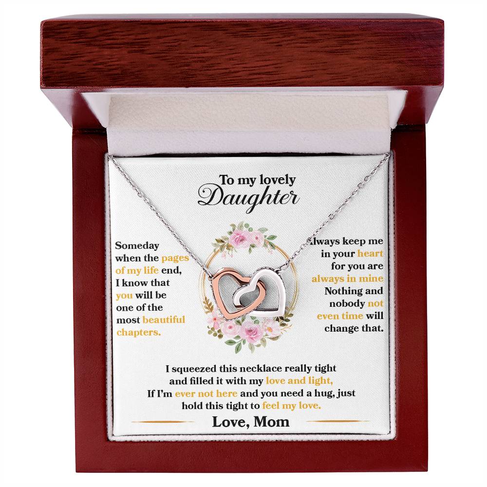 To My Lovely Daughter, Hold This Tight To Feel My Love" Interlocking Hearts necklace in a gift box with a sentimental message for a daughter from a mother, featuring CZ crystals by ShineOn Fulfillment.