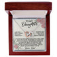 A square wooden gift box featuring pink roses contains an Interlocking Hearts Necklace adorned with cubic zirconia crystals. It includes a "To My Daughter" card with a loving message from "Love, Dad." Product: Daughter-Eternal Home - Interlocking Hearts Necklace.