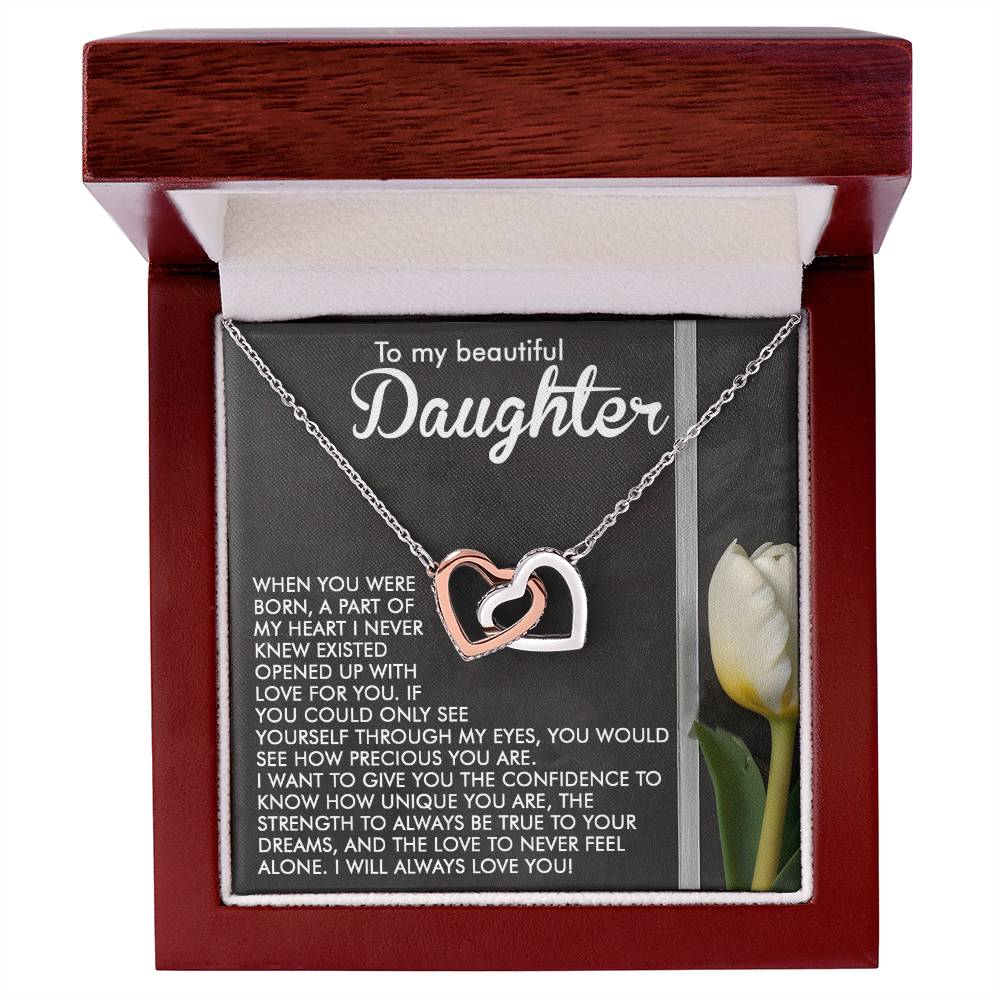 The "Daughter-Heart Love - Interlocking Hearts Necklace" features a silver chain with cubic zirconia-accented hearts in a wooden box. The lid says, "To my beautiful Daughter," and inside, there's a heartfelt letter with an image of a white tulip.