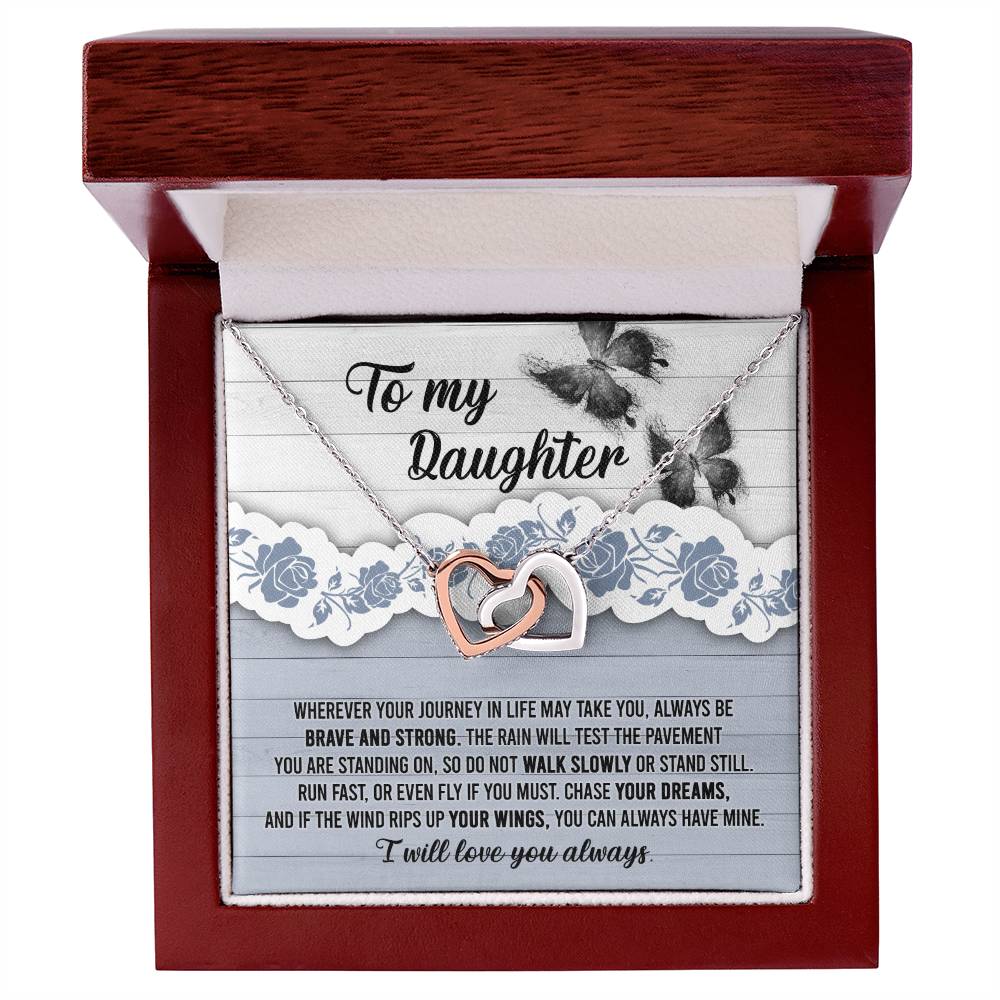 The "To Daughter, Always Have Mine - Interlocking Hearts Necklace," adorned with cubic zirconia crystals, is beautifully presented against a decorative card that inspires bravery, strength, and the pursuit of dreams. The message is addressed "To my Daughter" and concludes with "I will love you always.