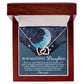 The jewelry box holds an Interlocking Hearts necklace with a rose gold finish. Inside is a silhouetted face, moon, and stars adorned with cubic zirconia. A heartfelt message titled "To My Beautiful Daughter" accompanies the Daughter-Grown Heart - Interlocking Hearts Necklace.