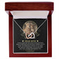 The "To Mom, My Everything - Interlocking Hearts Necklace," adorned with cubic zirconia crystals, comes in an elegant open box featuring a heartfelt message for a mother and an image of a lioness and cub, beautifully symbolizing the parent-child bond.