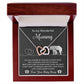 The "To Mama To Be, Until We Meet - Interlocking Hearts Necklace" is embellished with cubic zirconia crystals and presented in a wooden box. The message "To my Wonderful Mommy" includes a heartfelt note from an unborn baby, making it a unique gift of love and anticipation.