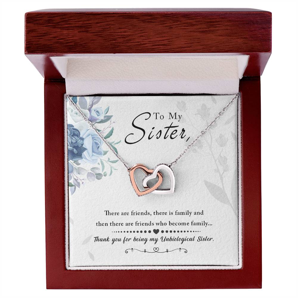 A gift box containing a "To My Sister, Thank You For Everything" Interlocking Hearts Necklace from ShineOn Fulfillment with cubic zirconia crystals and a sentimental note for a sister.