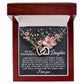 The Daughter-Love Sight jewelry box features an 18k yellow gold finish with an Interlocking Hearts necklace adorned with cubic zirconia. Inside, a floral design and a heartfelt message express love and happiness to a daughter, calling her "baby girl.