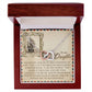 The Daughter-Withstand Storm Interlocking Hearts Necklace, embellished with cubic zirconia crystals, comes in a wooden box. A card accompanies it, inspiring your daughter with a motivational message about her strength and identity, comparing her resilience to enduring the fiercest storm.