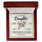 The Daughter-Heavy Tiara - Interlocking Hearts Necklace, featuring a rose gold finish and cubic zirconia crystals, is displayed in an open wooden box. The inner lid reads: "To My Beautiful Daughter," with a heartfelt message of love and support.