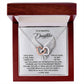 The Daughter-An Angel - Interlocking Hearts Necklace, embellished with cubic zirconia crystals and wing pendants, comes in an open wooden box with an inscription expressing love and admiration for a daughter.