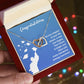 A person holds a red box with the ShineOn Fulfillment Future Is Bright - Interlocking Hearts Necklace adorned with cubic zirconia crystals and a message of congratulations and well wishes.