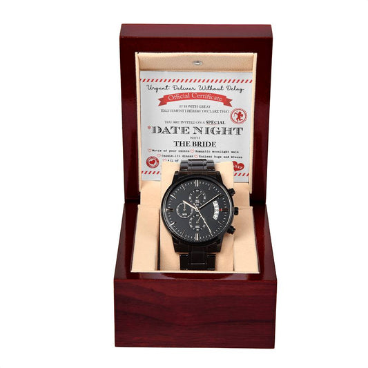 A luxury men's watch, the "To Groom, Date Night - Metal Chronograph Watch," with a black metal strap is displayed in an open wooden box. This elegant timepiece comes with a certificate behind it, featuring the text "DATE NIGHT THE BRIDE.