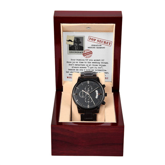 A To Groomsman, Top Secret - Metal Chronograph Watch in an open wooden box. Behind the watch, a "Top Secret" themed note with instructions for a groom's mission in a wedding is displayed.