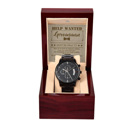 A "To Groomsman, Help Wanted - Metal Chronograph Watch" is displayed in an open wooden box. Inside the lid, a card reads "HELP WANTED Groomsman" with some text below it. The box has a beige interior.